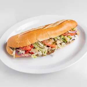 Baguette 10 pouces au steak speck, mozzarella, provolone, l&eacute;gumes et sauce maison