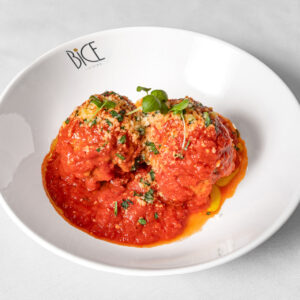 Bite-sized veal meatball with savory sauce, a Polpettine di Vitello dish from Italian cuisine