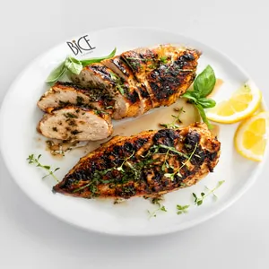 Grilled Mediterranean chicken breast with herbs, olive oil, and lemon