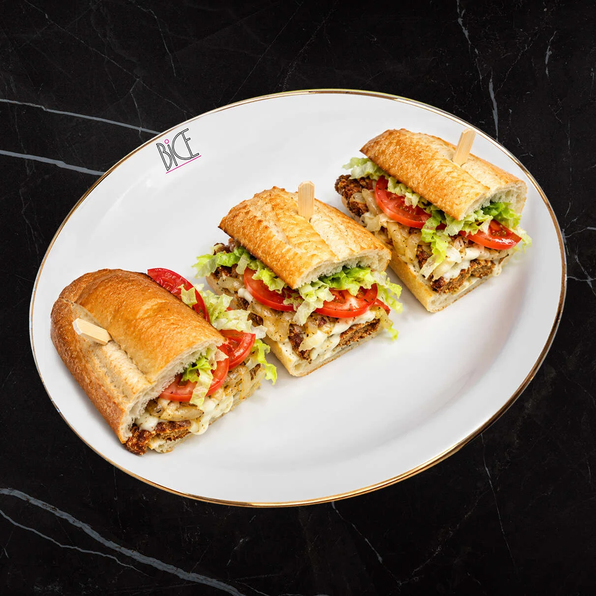Italian cuisine chicken cutlet baguette Italian cuisine crispy chicken cutlet baguette with mozzarella, provolone, roasted peppers, eggplant, lettuce and tomato