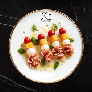 Italian cuisine skewers with prosciutto, bocconcini, fresh melon, and cherry tomatoes for elegant appetizers